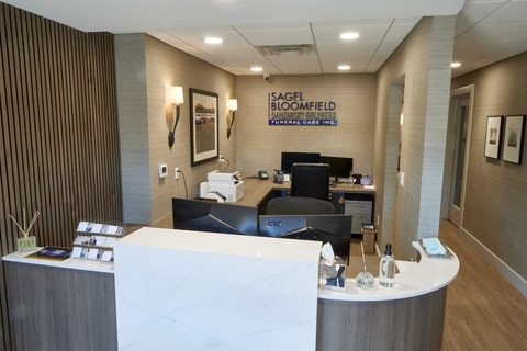 Reception desk and office area with computer workstations at Sagel Bloomfield Danzansky Goldberg Funeral Care